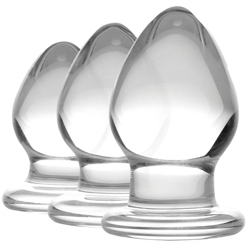 Teardrop Glass Anal Training Set with three clear graduated plugs standing upright on flared bases.