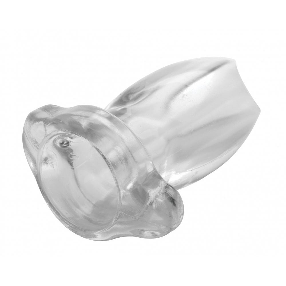 Clear hollow butt plug angled on a white background with tapered tip and flared base.