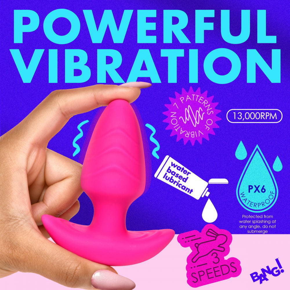 Hand holding the pink ribbed plug on a vibration feature graphic with speed and lubricant icons.