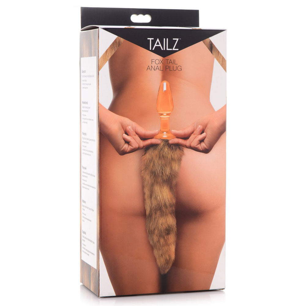 Retail box for the orange fox tail butt plug with artwork of its translucent plug and bushy tan-and-brown tail.