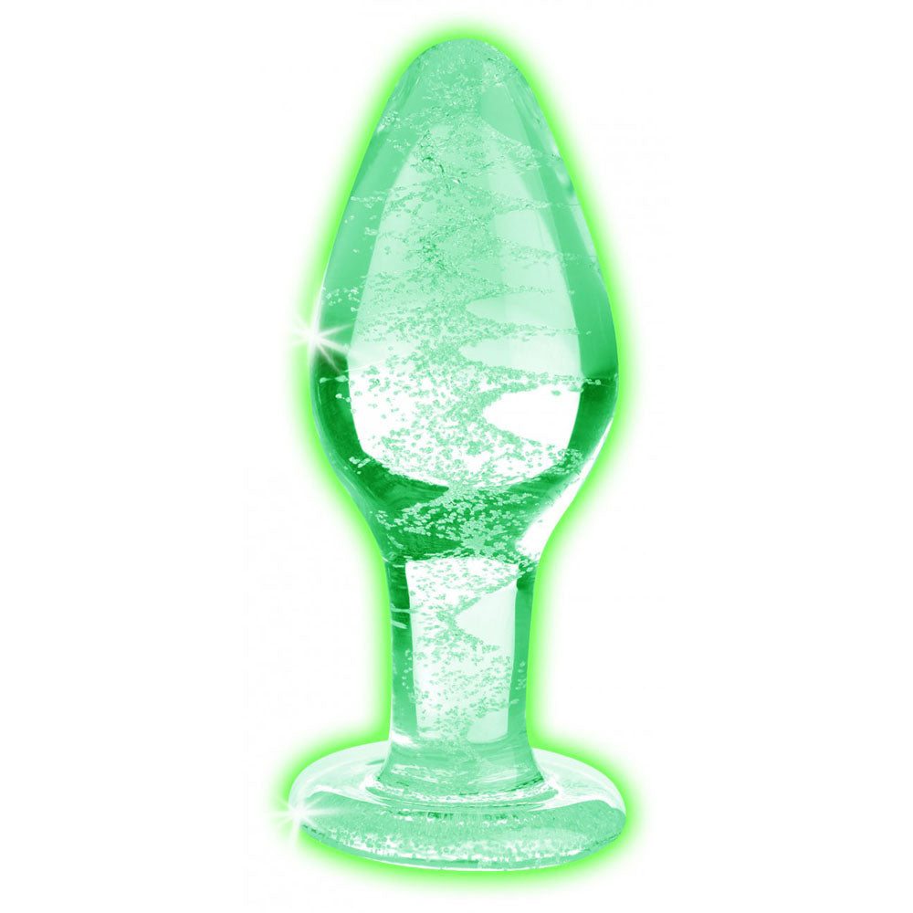 Glow-in-the-Dark Glass Butt Plug glowing green to show the light-charged swirl inside its clear body.