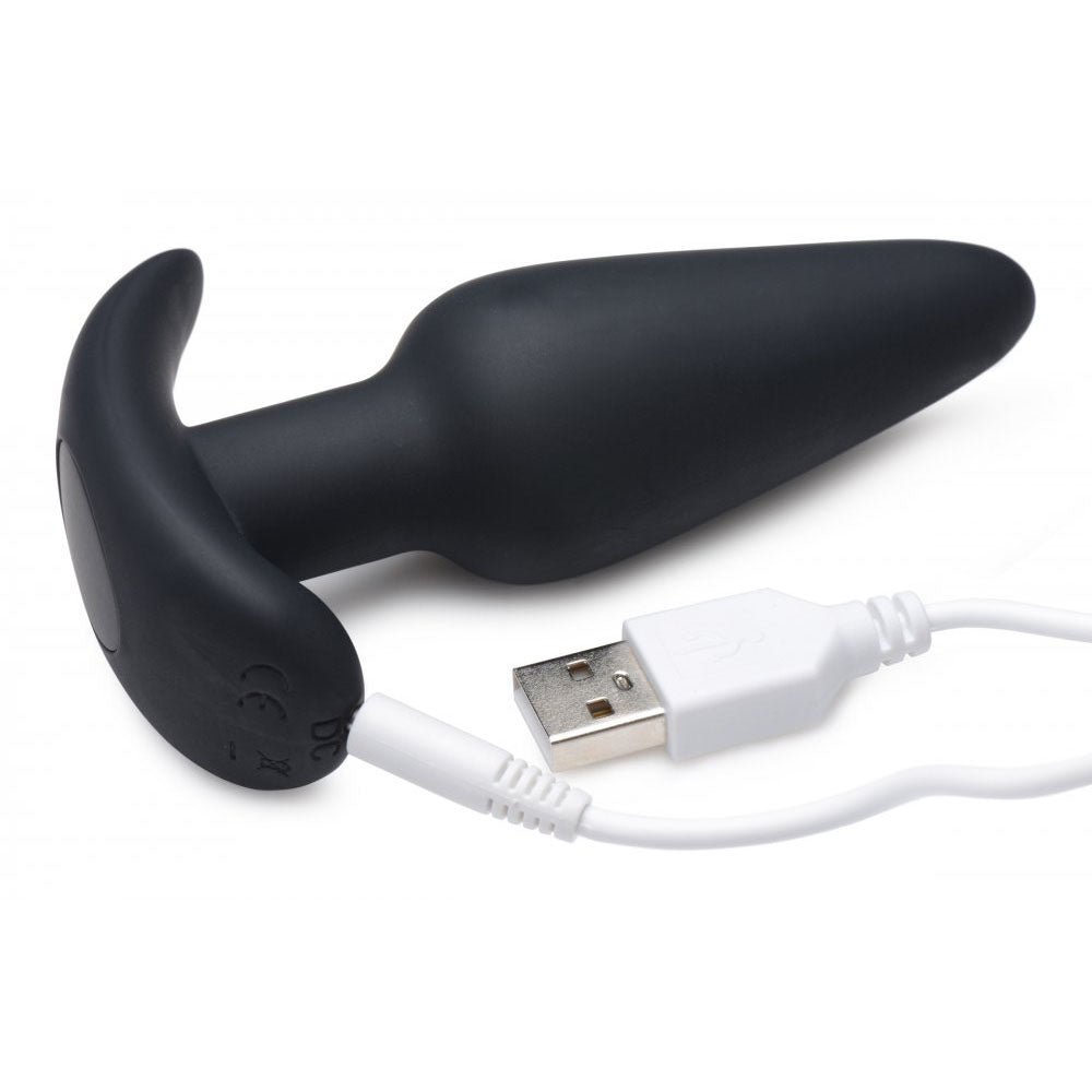 Black silicone plug connected to a white USB charging cable.
