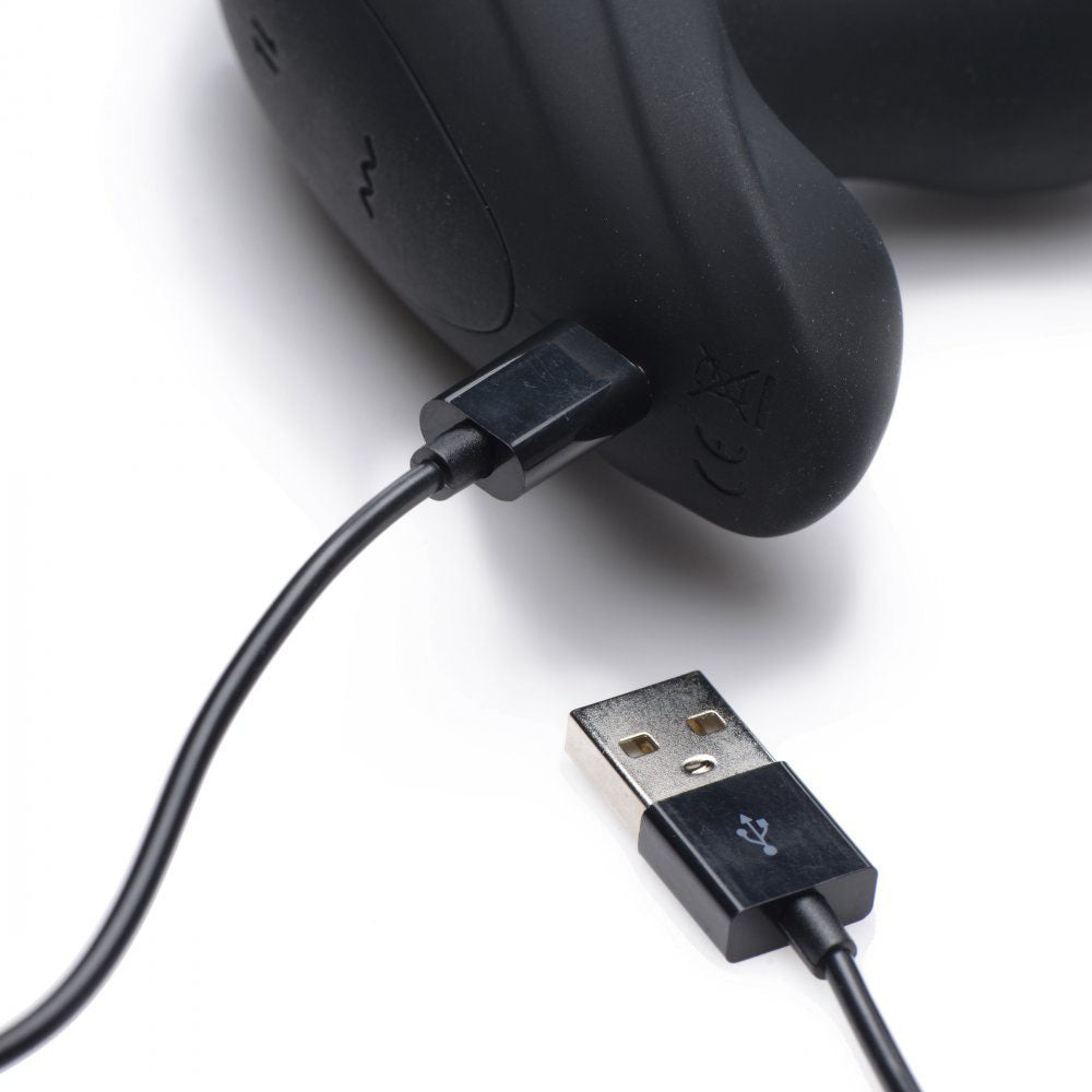 USB charging cable connected to the outside base of the black plug.