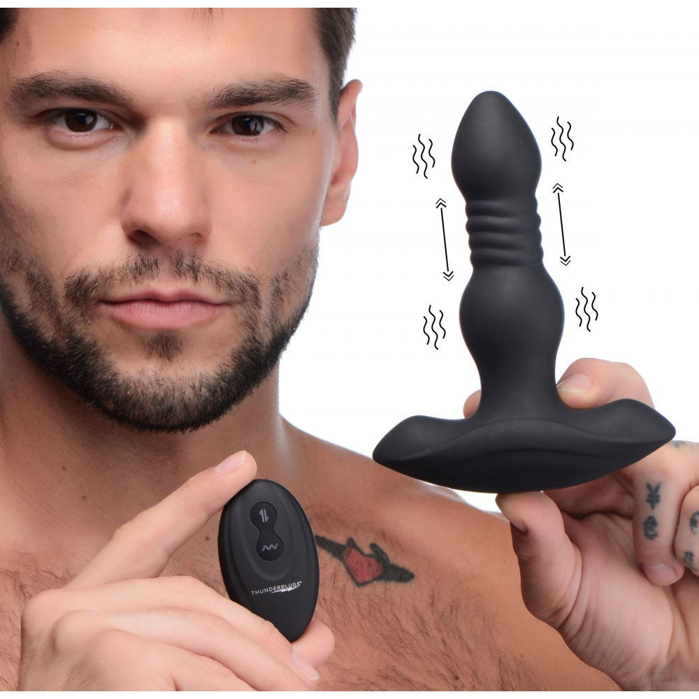 Model holding the black plug and remote beside vibration waves and up-and-down motion arrows.
