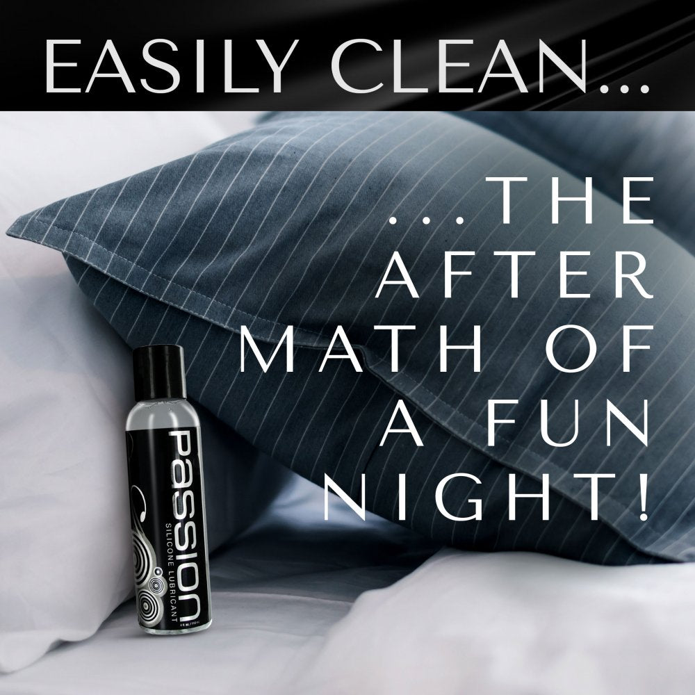 Bottle of unscented silicone liquid resting against blue pillows emphasizing easy cleanup with soap and water