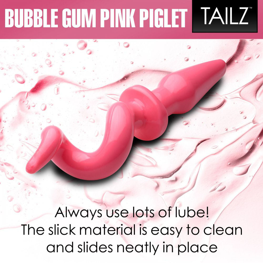 Pink curly tail butt plug shown on a lube-themed graphic with use-lots-of-lube text