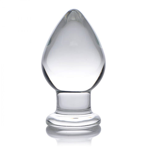 Upright clear glass butt plug with a rounded tapered tip, narrow neck, and wide flared base.