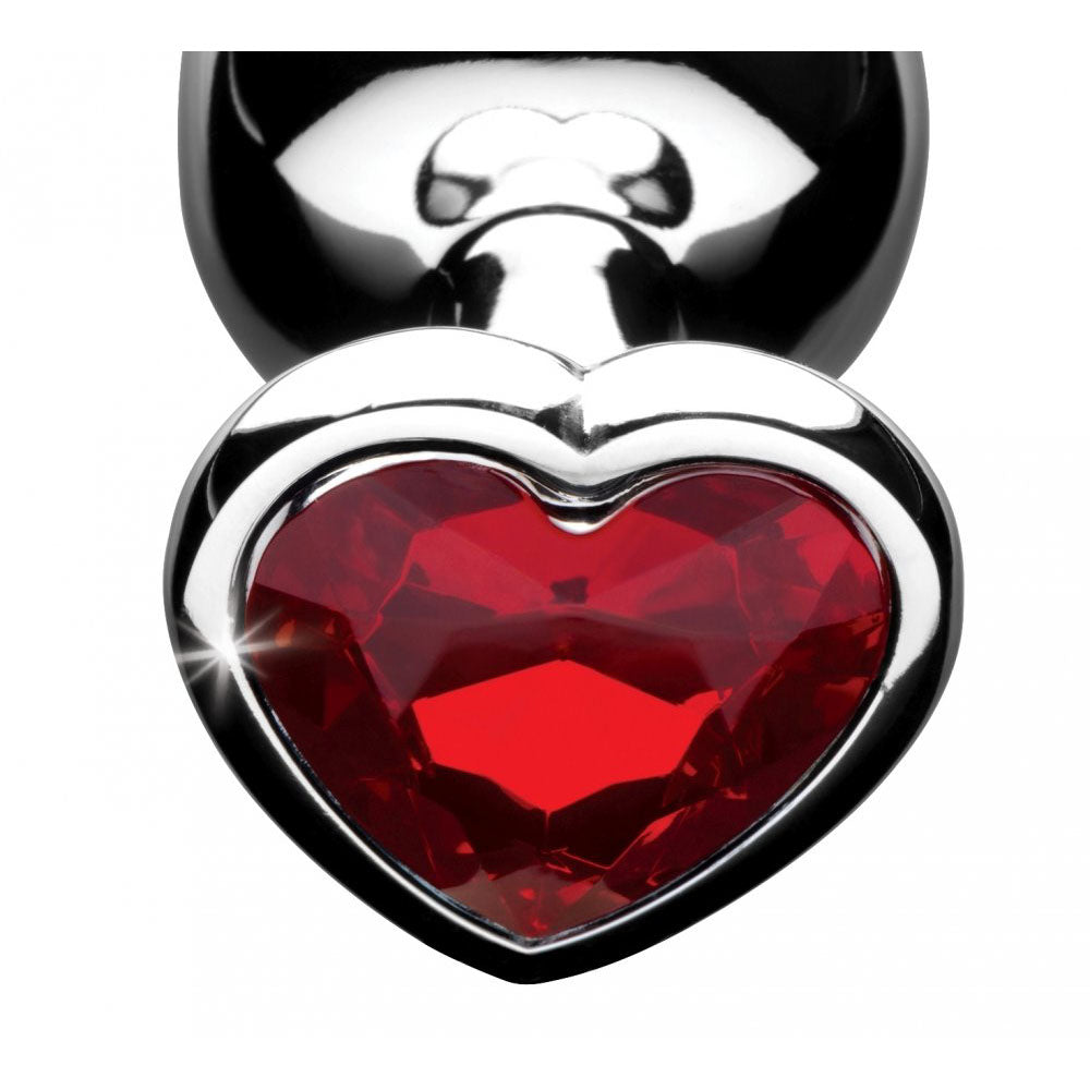 Close-up of the faceted red heart gem base on a silver-toned plug