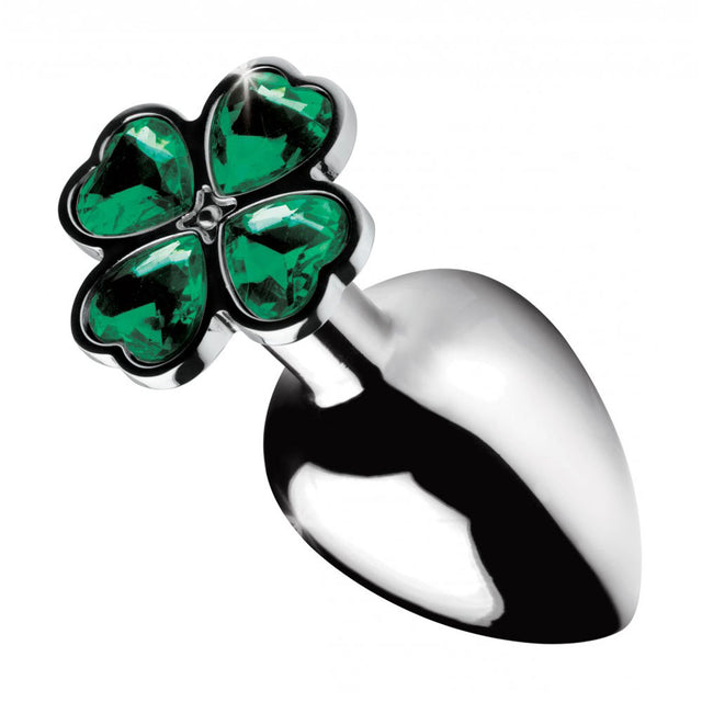 Close-up of the green four-leaf clover gem top above the polished silver-toned plug.