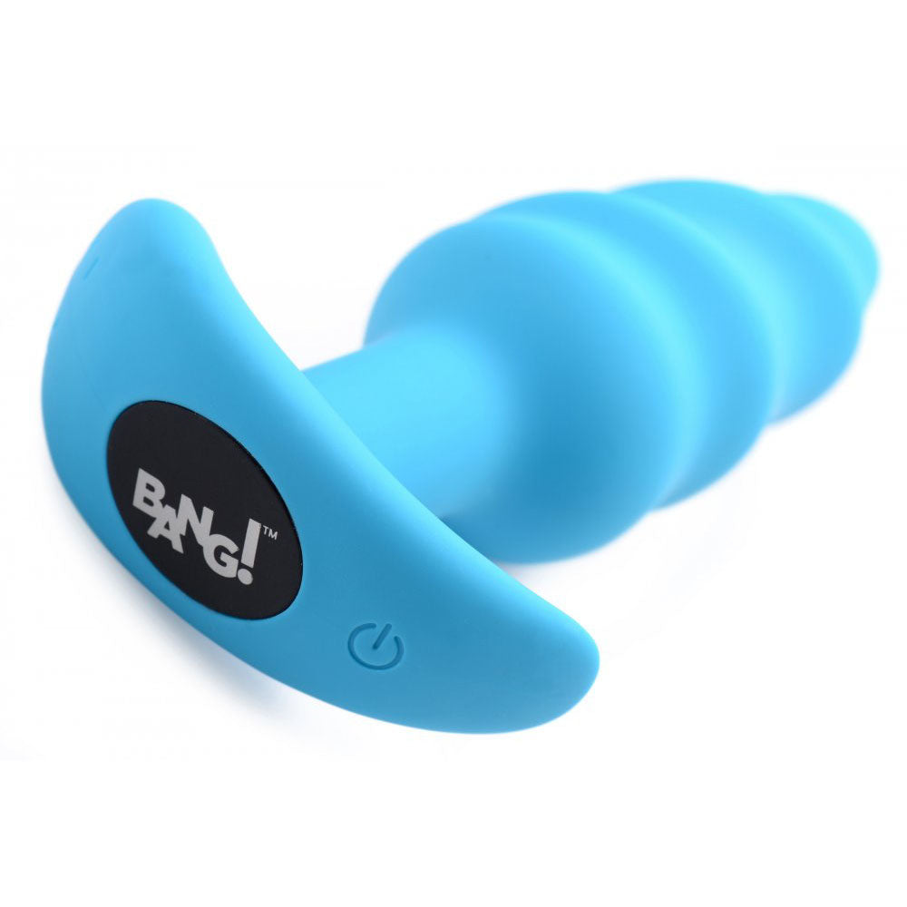 Blue silicone swirl butt plug close-up showing the flared base, power button, and raised spiral texture.