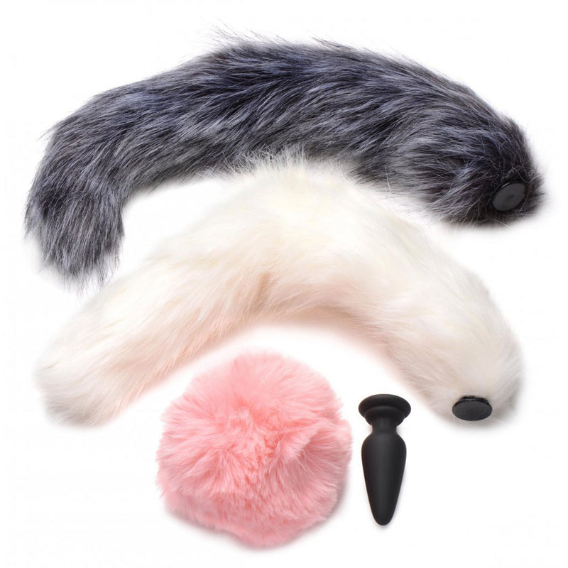 Gray and white furry tails, a round pink tail and a separate black plug base arranged on a white background.