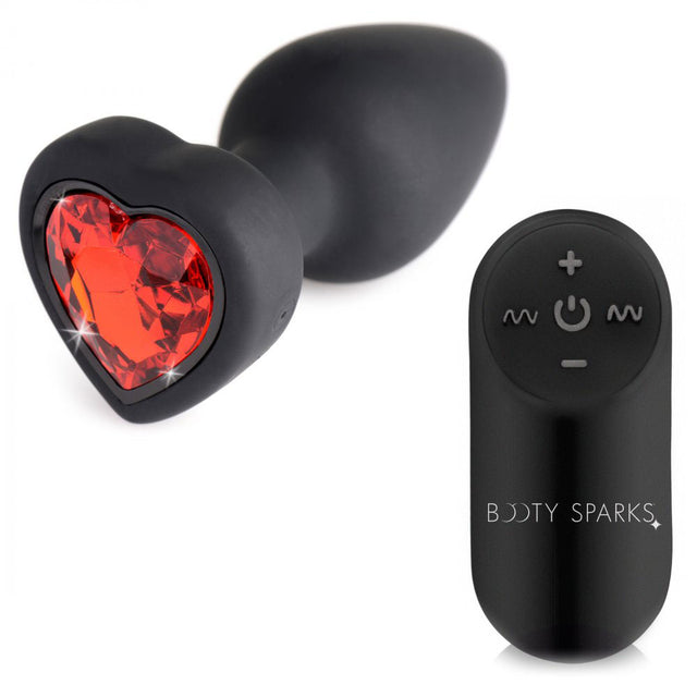 Ruby heart vibrating silicone butt plug with remote displayed together on a white background.