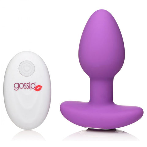 Upright purple plug beside a white remote on a white background.