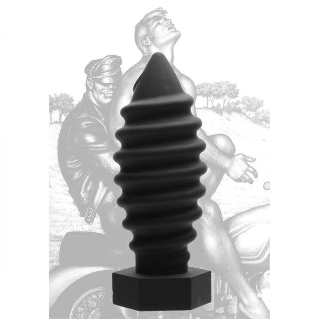 Black screw-shaped plug displayed in front of grayscale collector card artwork with wide base visible